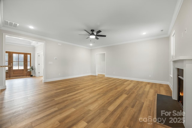 unfurnished living room with light wood-type flooring, a fireplace with flush hearth, visible vents, and baseboards