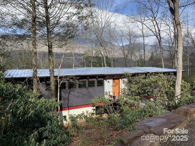 exterior space featuring metal roof