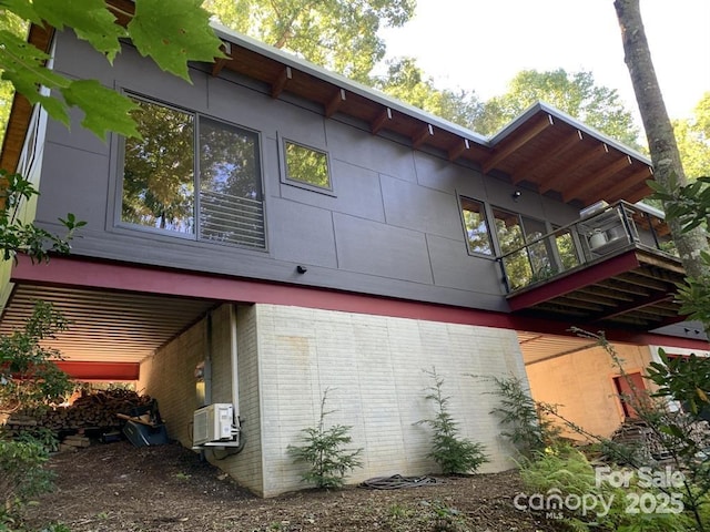 view of side of home with brick siding