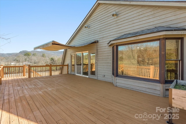 wooden terrace featuring a mountain view