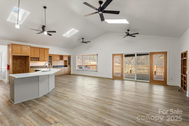 kitchen featuring a skylight and open floor plan