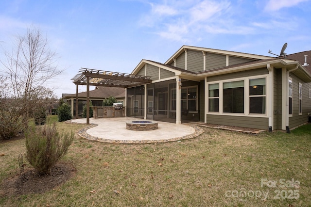 rear view of property with a lawn, a sunroom, a patio area, a pergola, and a fire pit