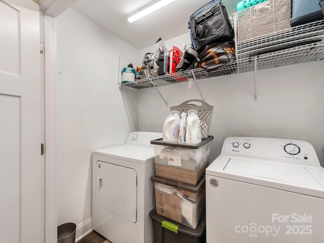 washroom featuring washer and clothes dryer and laundry area