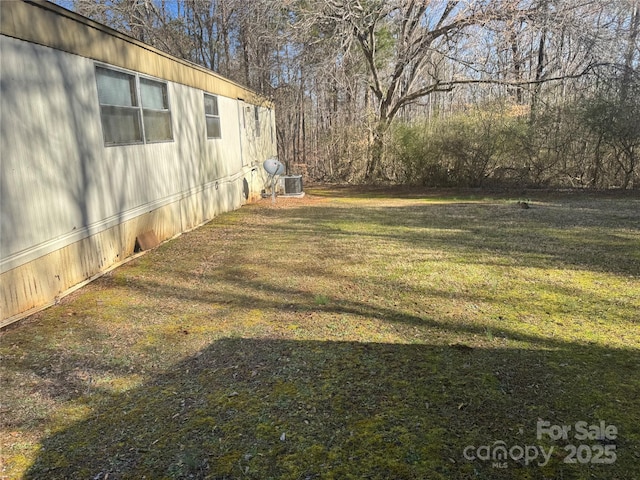 view of yard featuring central AC unit