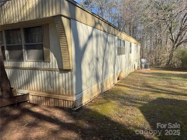 view of home's exterior with a yard