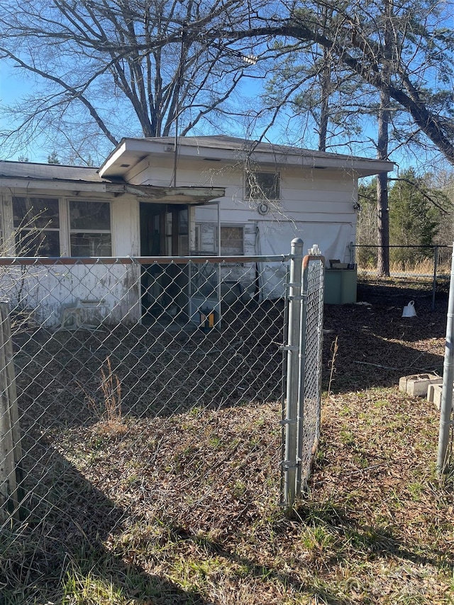 view of home's exterior with fence