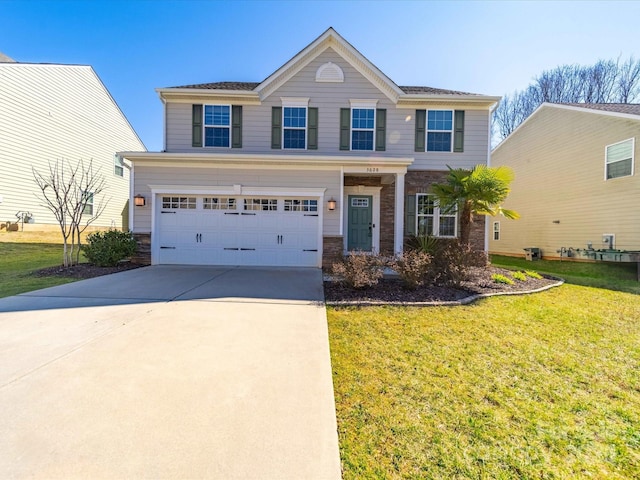 view of front of property featuring a garage, driveway, stone siding, and a front yard