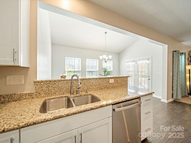 kitchen with a sink, plenty of natural light, white cabinets, and stainless steel dishwasher