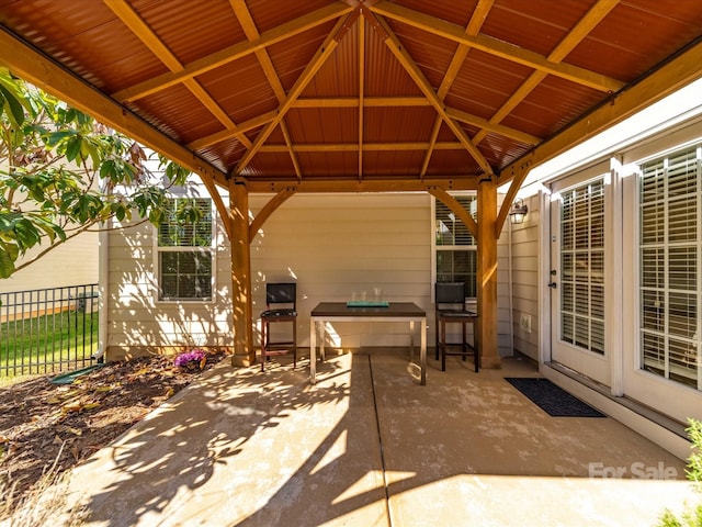 view of patio / terrace with fence and a gazebo