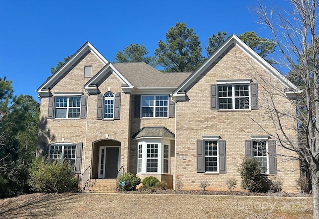 view of front of property featuring brick siding