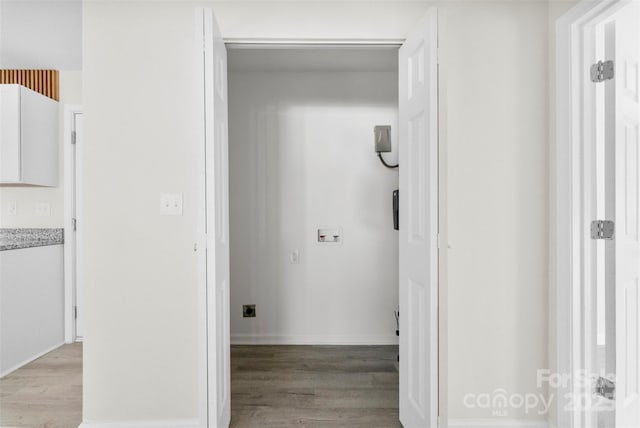 hallway with light wood-type flooring