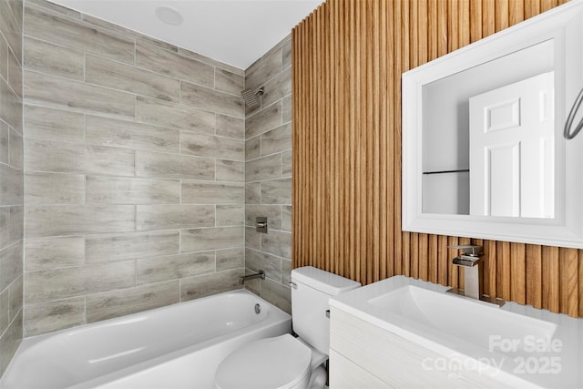 bathroom with shower / bath combination, vanity, and toilet