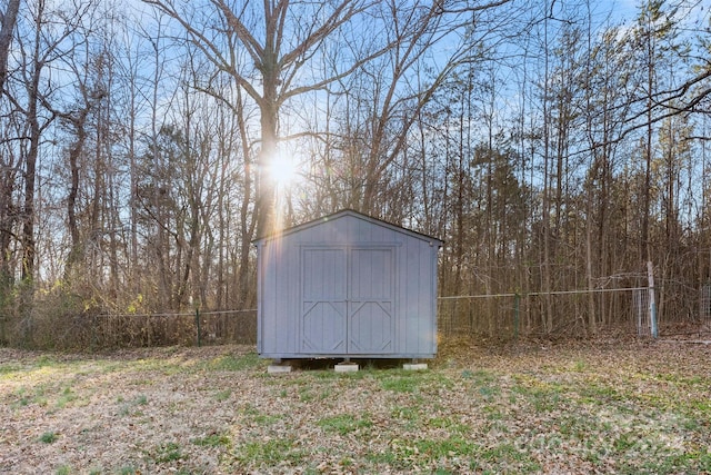 view of shed with fence