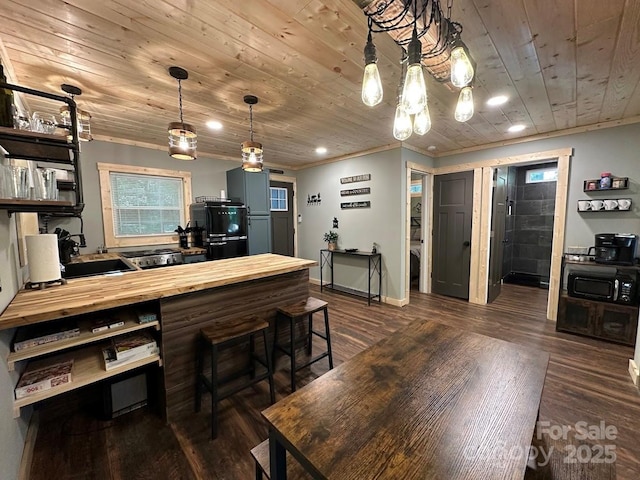 kitchen featuring dark wood-style floors, wood ceiling, wood counters, black microwave, and open shelves