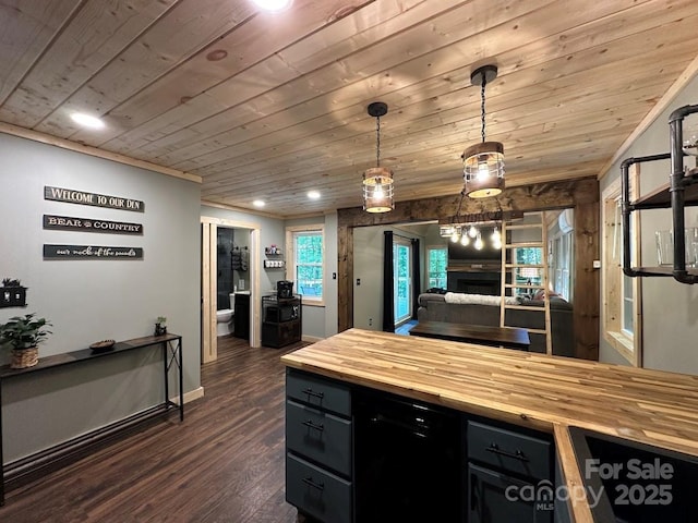 kitchen featuring decorative light fixtures, a fireplace, dark wood-type flooring, wood counters, and wooden ceiling