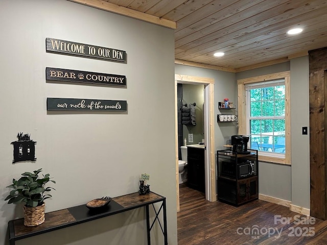 corridor with recessed lighting, wood ceiling, baseboards, and dark wood-style flooring