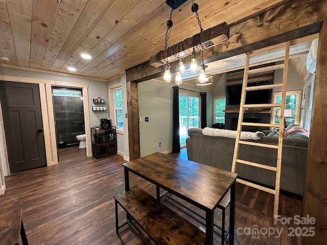 dining space with wood ceiling, baseboards, vaulted ceiling, and wood finished floors