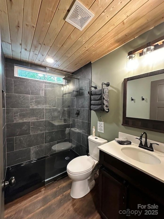 full bathroom with visible vents, toilet, wooden ceiling, vanity, and a walk in shower