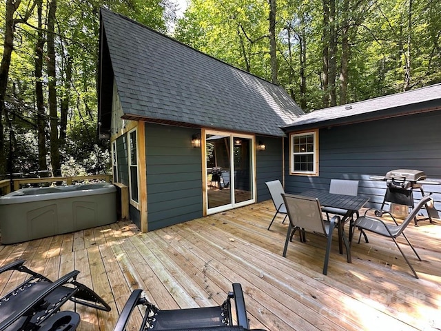 wooden deck with a grill and outdoor dining space