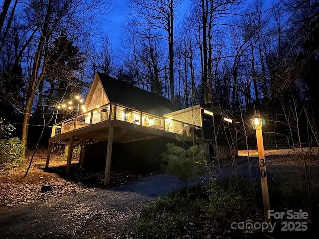 view of side of home featuring a deck