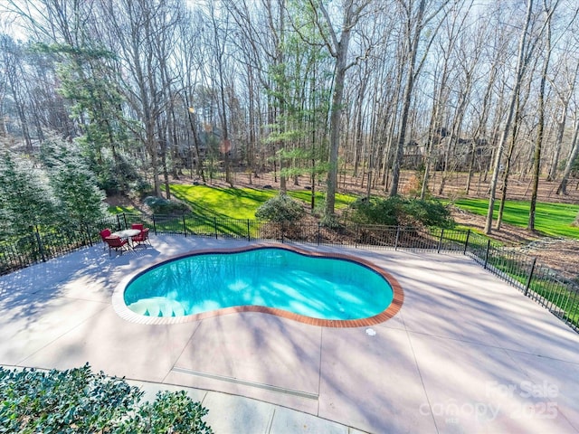 view of pool with a fenced in pool, a patio, and fence