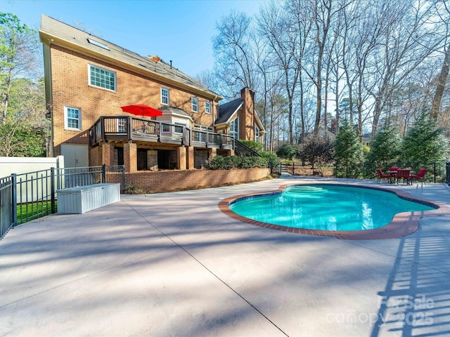 view of swimming pool with a fenced in pool, a patio, stairs, fence, and a wooden deck