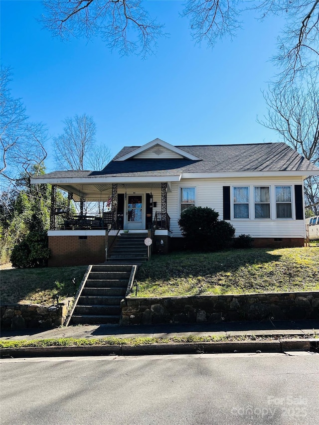 view of front of home with a porch, crawl space, and a shingled roof