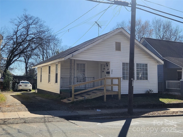 view of front of home featuring a porch and roof with shingles