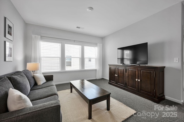 carpeted living area with visible vents and baseboards