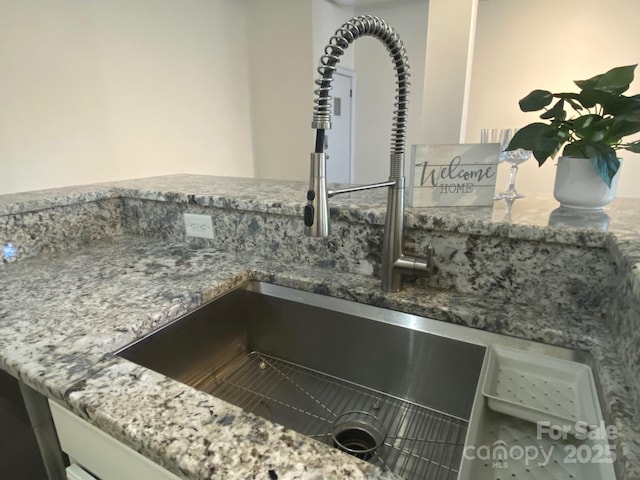 404 N Laurel Ave Unit 28, Charlotte, NC 28204 - room details with stone countertops and a sink