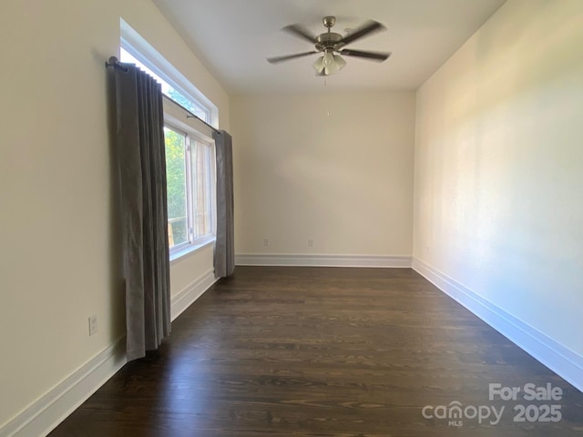 404 N Laurel Ave Unit 28, Charlotte, NC 28204 - unfurnished room featuring a ceiling fan, baseboards, and dark wood-type flooring
