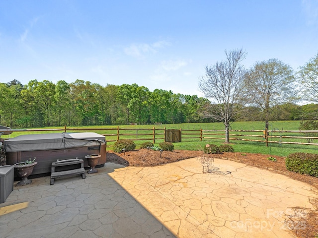 view of patio featuring a fenced backyard and a hot tub