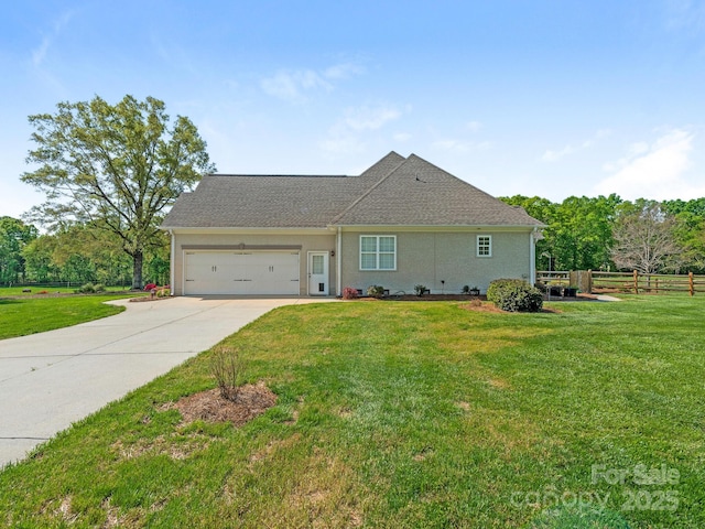 single story home with an attached garage, fence, driveway, and a front lawn