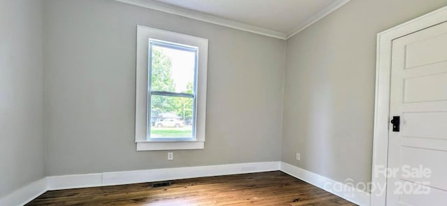 unfurnished room featuring ornamental molding, visible vents, dark wood finished floors, and baseboards