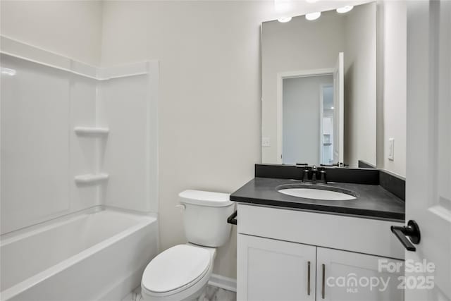 bathroom with toilet, tub / shower combination, and vanity