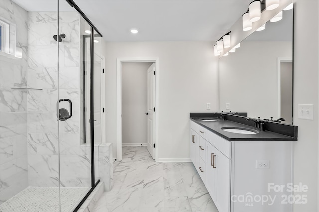 bathroom with marble finish floor, a sink, and a marble finish shower