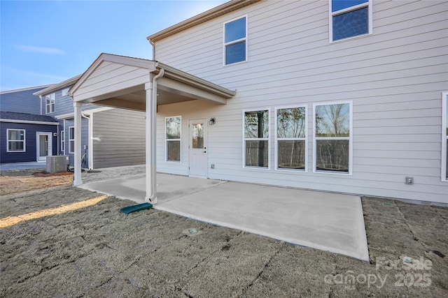 back of property featuring a patio area and central air condition unit