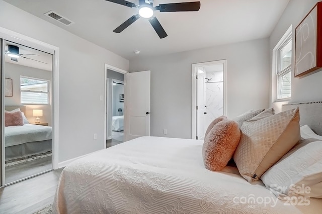 bedroom featuring connected bathroom, visible vents, and a ceiling fan