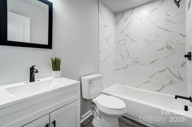 bathroom featuring shower / bathing tub combination, vanity, and toilet