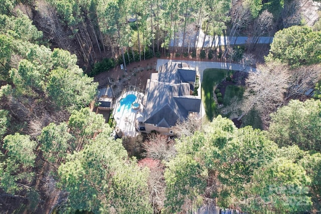 bird's eye view featuring a forest view