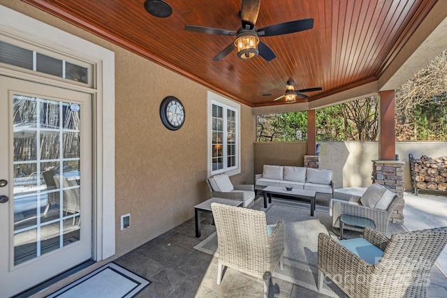 view of patio featuring a ceiling fan and outdoor lounge area