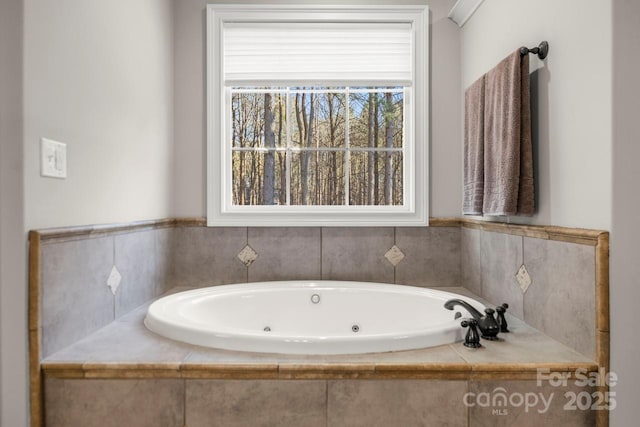 full bath featuring a whirlpool tub