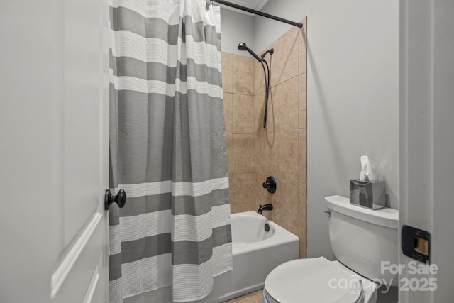 bathroom with shower / bath combo and toilet