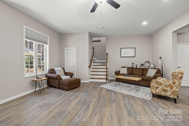 living room with baseboards, a ceiling fan, stairway, wood finished floors, and recessed lighting