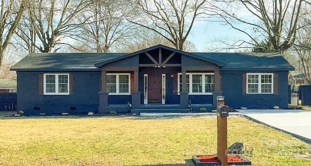 view of front facade with crawl space, a front yard, and brick siding