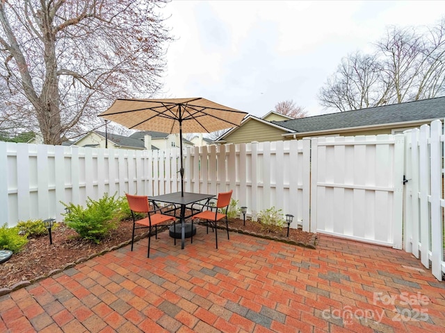 view of patio / terrace with outdoor dining space and a fenced backyard