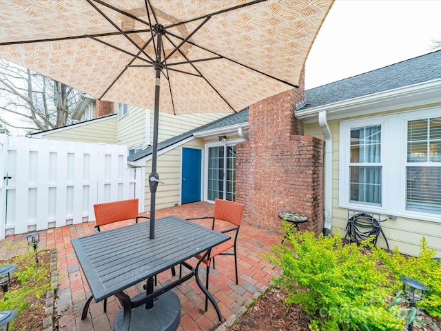 view of patio / terrace featuring outdoor dining area and fence