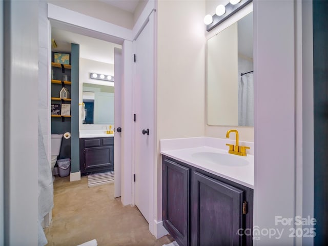 full bathroom featuring concrete floors and vanity