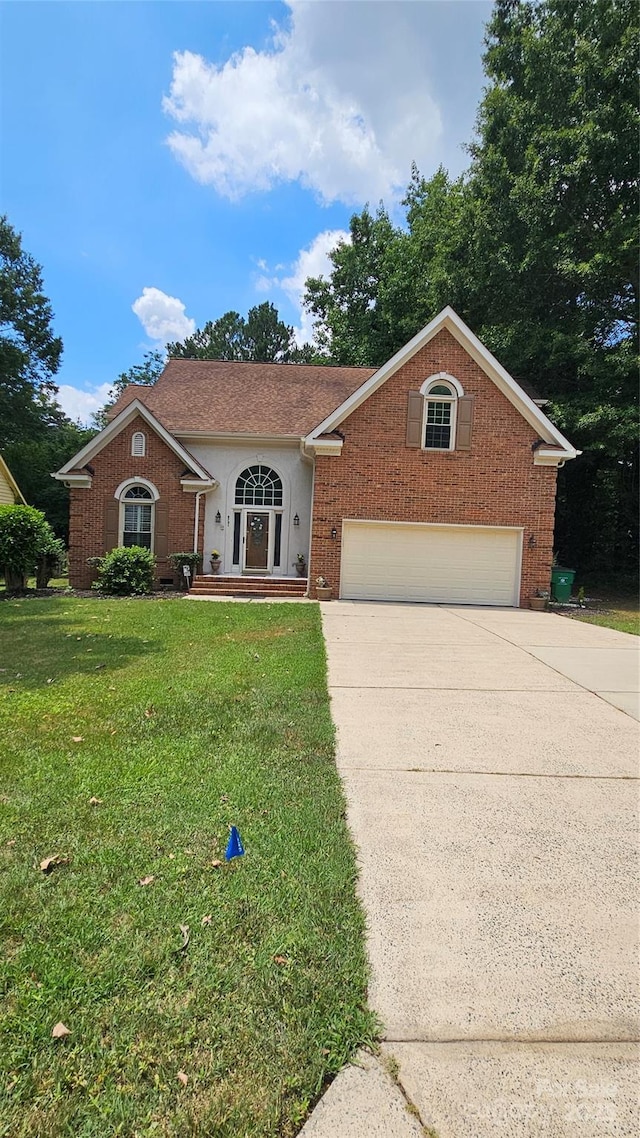 view of front of property with a garage, a front lawn, concrete driveway, and brick siding