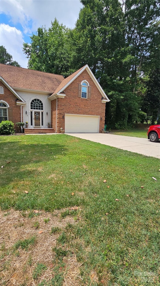 view of front of property featuring a garage, a front lawn, concrete driveway, and brick siding